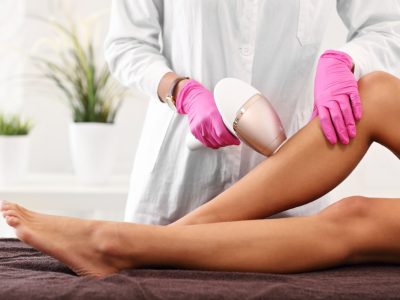 Picture of adult woman having laser hair removal in professional beauty salon