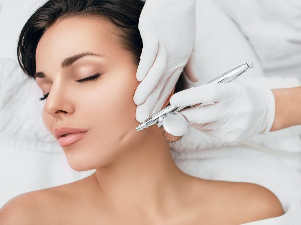 Face,Of,Beautiful,Woman,While,Procedure,Jet,Peeling,,Facial,Treatment